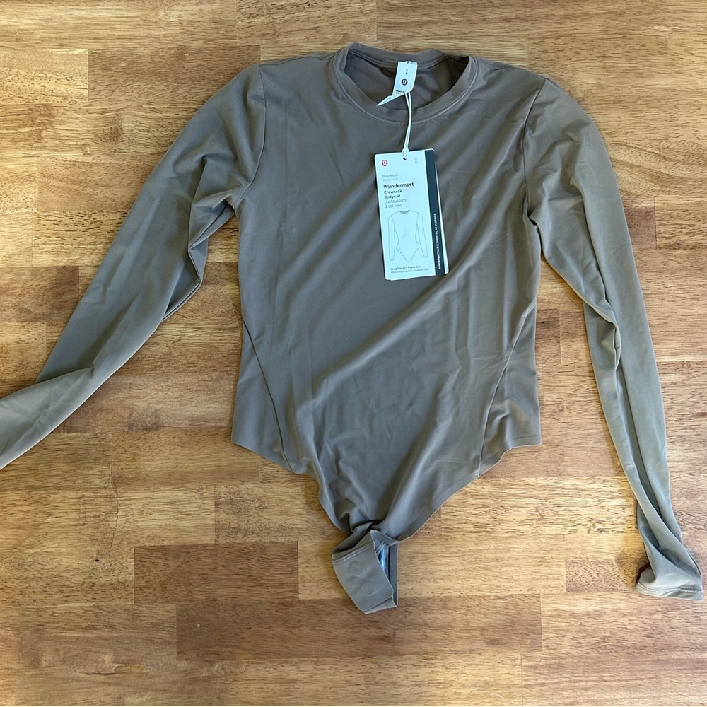 Lululemon bodysuit tan colored, brand new never worn! Tags still on!